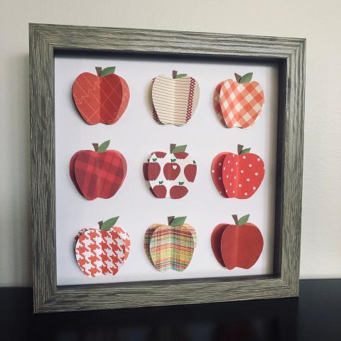 Shadowbox of paper apples